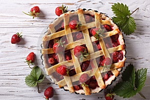 Strawberry pie in baking dish on the table horizontal top view