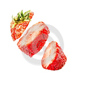 Sliced strawberry in the air isolated on white background