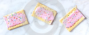 Strawberry pop tart panoramic banner on a white marble background