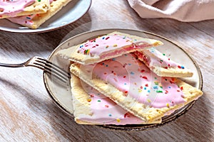 Strawberry pop tarts on a plate on a wooden table