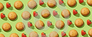 Strawberry protein Cookies in a pattern with fresh strawberries on the green pastel background. No sugar. Top view. Healthy and