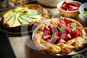 Strawberry puffed pastry pie with mint leaves