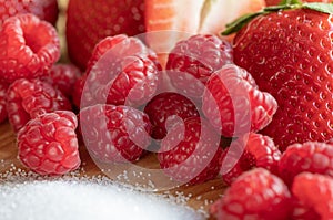 Strawberry. Raspberry. Fruits. Sugar. Raw. Macro. Red