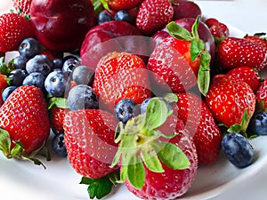 Strawberry , Red Plums ,Blueberry Still Life on White Background , Healthy food ,Summer Berry Gardening