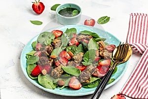 Strawberry salad with chicken liver, spinach, almond and mint. Ketogenic diet dinner, Keto paleo lunch. Food recipe background.