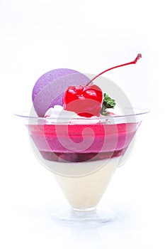 Strawberry shot cake with cherry and macaron