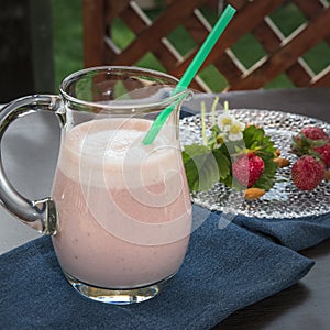 Strawberry smoothie with milk and almonds