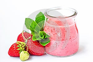 Strawberry smoothie or milkshake in glass jar with fresh strawberry fruits and mint isolated on white background, healthy food for