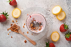 Strawberry smoothie. Vegan smoothie or milkshake from strawberry, banana and mint on white wooden table background. Clean eating,