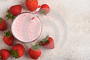 Strawberry smoothie. Vegan smoothie or milkshake from strawberry, banana and mint on white wooden table background. Clean eating,