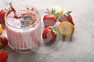 Strawberry smoothie. Vegan smoothie or milkshake from strawberry, banana and mint on white wooden table background. Clean eating,