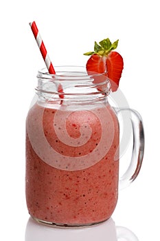 Strawberry smoothies with banana and orange juice in a glass jar