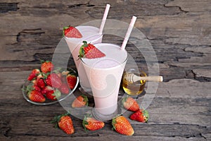 Strawberry smoothies colorful fruit juice milkshake blend beverage healthy .