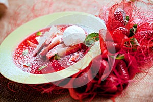 Strawberry soup with ice cream and mint