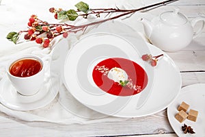 Strawberry soup with ice cream and mint.