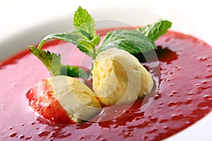 Strawberry soup with natural ice cream and mint