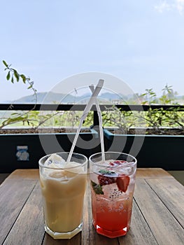 This is strawberry sparklinks and lychee yakult drinks with beautiful mountain view