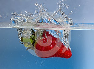 Strawberry splash in water