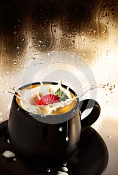 Strawberry splash in milk.