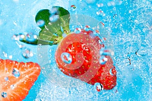 Strawberry splash in water- top view