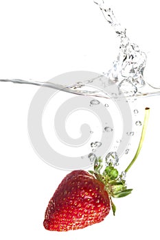 Strawberry splashing into water