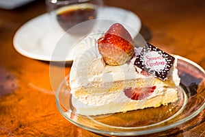 Strawberry sponge cake served with coffee. photo