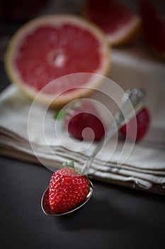 Strawberry on the spoon still life