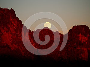 The Strawberry Supermoon Rising over the Superstition Mountains at Sunset