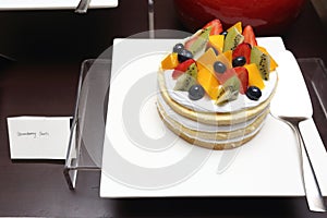 Strawberry Tarts variety fruit with silver cake spatula Grand Dessert Buffet in Luxury Restaurant Hotel