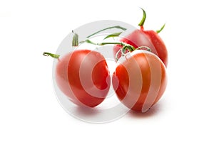 Strawberry tomatoes over white