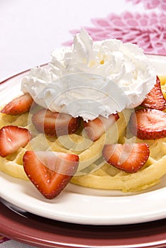 Strawberry waffles with whipped cream