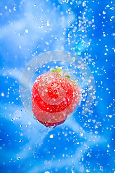 Strawberry in a water splash