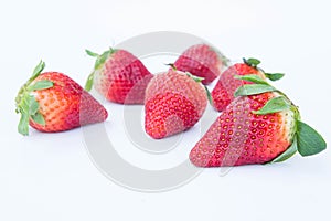 Strawberry on white background fruit`s healthful cordial, useful