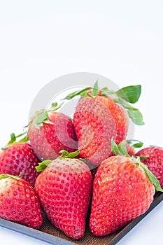 Strawberry on white background fruit`s healthful cordial, useful