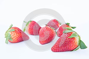 Strawberry on white background fruit`s healthful cordial, useful