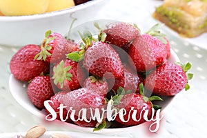Strawberry on white bawl photo