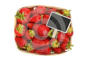 Strawberry in wooden basket with price sign