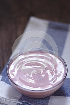 Strawberry yogurt in a small glass bowl