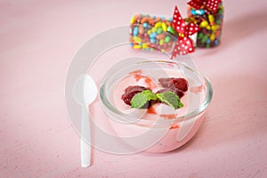 strawberry yogurt with strawberry on pink background. strawberry yoghurt. pink yogurt. strawberry in strawberry yogurt. heart in