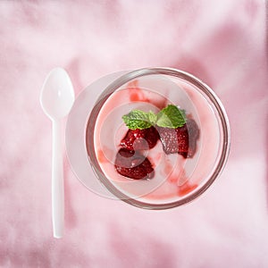 Strawberry yogurt with strawberry on pink background. strawberry yoghurt. pink yogurt. strawberry in strawberry yogurt. heart in