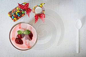Strawberry yogurt with strawberry  on wooden. strawberry yoghurt. pink yogurt. strawberry in strawberry yogurt. heart in yogurt.