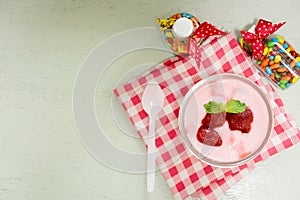 Strawberry yogurt with strawberry  on wooden. strawberry yoghurt. pink yogurt. strawberry in strawberry yogurt. heart in yogurt.