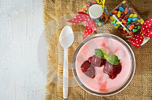 Strawberry yogurt with strawberry  on wooden. strawberry yoghurt. pink yogurt. strawberry in strawberry yogurt. heart in yogurt.