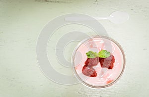 Strawberry yogurt with strawberry  on wooden photo