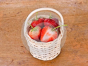 Strawberrys in the basket on wood background