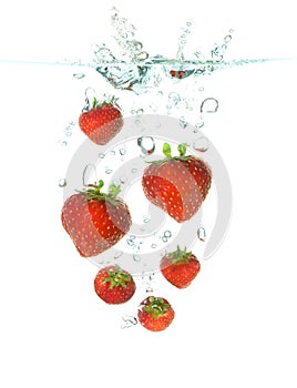 Strawberrys falling in water