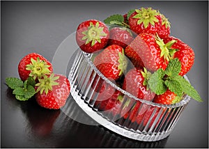 Strawberrys in glassbowl and black background