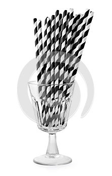 Straws in glass on white background