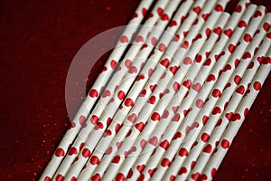 Bundle of straws with printed hearts.