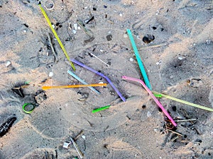 Straws are waste on beach photo